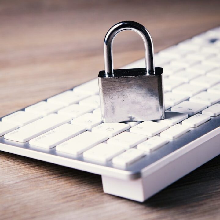 a computer keyboard with a padlock on top of it